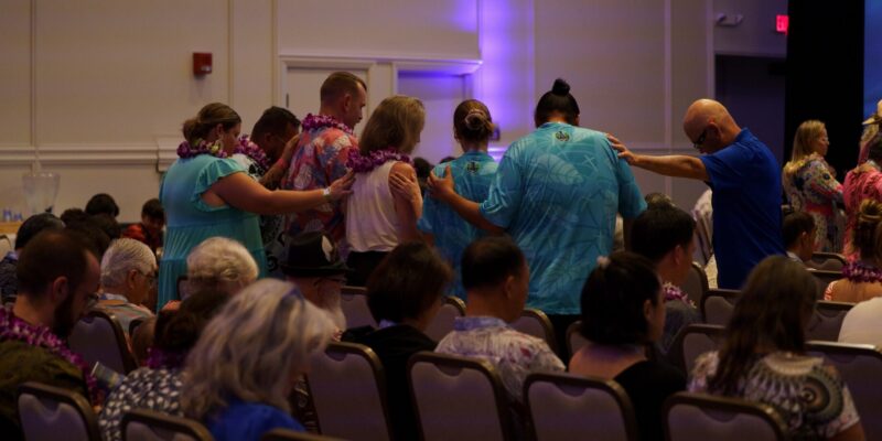 Photo of people praying for new pastors at the HPBC Annual Meeting Nov. 2025